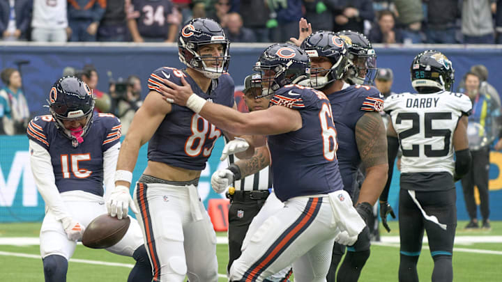 Oct 13, 2024; London, United Kingdom;  Chicago Bears tight end Cole Kmet (85)  celebrates scoring a touchdown with teammates during an NFL International Series game at Tottenham Hotspur Stadium. Mandatory Credit: Peter van den Berg-Imagn Images