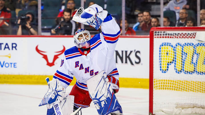 Jan 2, 2020; Calgary, Alberta, CAN; New York Rangers goaltender Henrik Lundqvist (30) makes a save against the Calgary Flames during the first period at Scotiabank Saddledome. Mandatory Credit: Sergei Belski-Imagn Images
