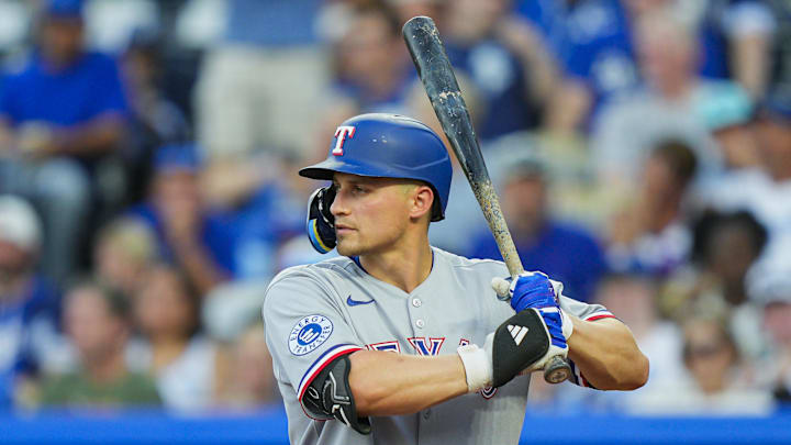 Aug 18, 2025; Kansas City, Missouri, USA; Texas Rangers shortstop Corey Seager (5) bats during the third inning against the Kansas City Royals at Kauffman Stadium. 