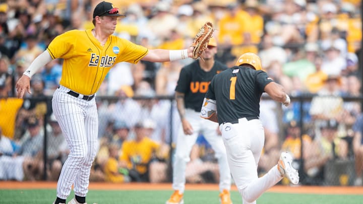 Southern Miss first baseman Christopher Sargent (41) makes the catch before tagging Tennessee infielder Christian Moore (1) out during a NCAA baseball super regional game between Tennessee and Southern Mississippi held at Pete Taylor Park in Hattiesburg, Miss., on Saturday, June 10, 2023.