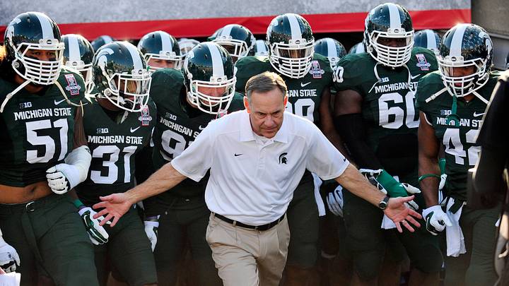 January 1, 2014; Pasadena, CA, USA; Michigan State Spartans head coach Mark Dantonio leads the Spartans to play against the Stanford Cardinal at Rose Bowl. Mandatory Credit: Gary A. Vasquez-USA TODAY Sports January 1, 2014; Pasadena, CA, USA; Michigan State Spartans head coach Mark Dantonio leads the Spartans to play against the Stanford Cardinal at Rose Bowl. Mandatory Credit: Gary A. Vasquez-USA TODAY Sports