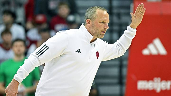 Nov 20, 2025; Bloomington, Indiana, USA; Indiana Hoosiers head coach Darian Devries looks to high-five his players during a timeout during the second half against the Lindenwood Lions at Simon Skjodt Assembly Hall. Mandatory Credit: Robert Goddin-Imagn Images