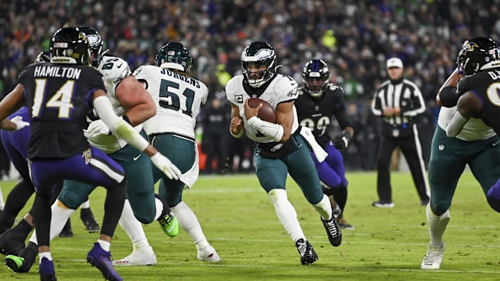 Dec 1, 2024; Baltimore, Maryland, USA; Philadelphia Eagles quarterback Jalen Hurts (1) rushes through the line during the first half against the Baltimore Ravens at M&T Bank Stadium. Mandatory Credit: Tommy Gilligan-Imagn Images
