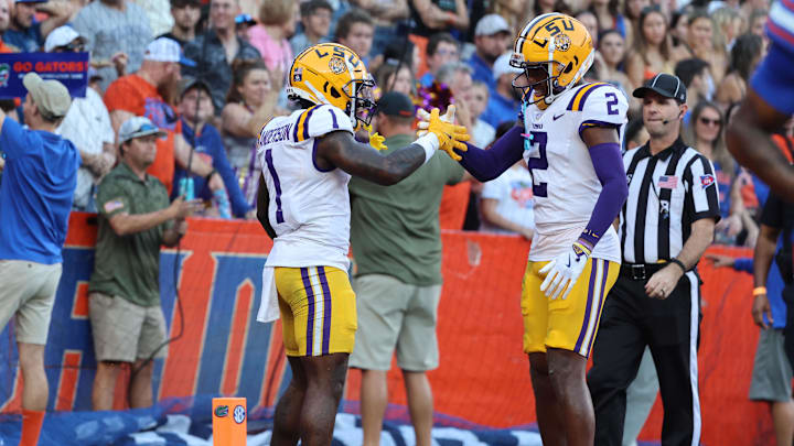 Nov 16, 2024; Gainesville, Florida, USA; LSU Tigers wide receiver Aaron Anderson (1) celebrates with wide receiver Kyren Lacy (2) after he scored a touchdown against the Florida Gators during the first half at Ben Hill Griffin Stadium. Mandatory Credit: Kim Klement Neitzel-Imagn Images Nov 16, 2024; Gainesville, Florida, USA; LSU Tigers wide receiver Aaron Anderson (1) celebrates with wide receiver Kyren Lacy (2) after he scored a touchdown against the Florida Gators during the first half at Ben Hill Griffin Stadium. Mandatory Credit: Kim Klement Neitzel-Imagn Images