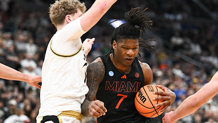 Mar 22, 2026; St. Louis, MO, USA; Miami Hurricanes forward Shelton Henderson (7) drives to the basket as Purdue Boilermakers guard Jack Benter (14) defends during the second half during a second round game of the men's 2026 NCAA Tournament at Enterprise Center. Mandatory Credit: Jeff Le-Imagn Images Mar 22, 2026; St. Louis, MO, USA; Miami Hurricanes forward Shelton Henderson (7) drives to the basket as Purdue Boilermakers guard Jack Benter (14) defends during the second half during a second round game of the men's 2026 NCAA Tournament at Enterprise Center. Mandatory Credit: Jeff Le-Imagn Images