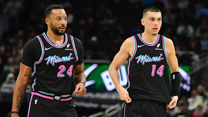 Feb 24, 2026; Milwaukee, Wisconsin, USA;  Miami Heat guard Norman Powell (24) and guard Tyler Herro (14) looks on in the third quarter against the Milwaukee Bucks at Fiserv Forum. Mandatory Credit: Benny Sieu-Imagn Images