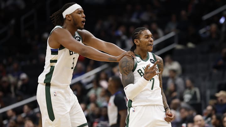 Dec 1, 2025; Washington, District of Columbia, USA; Milwaukee Bucks guard Kevin Porter Jr. (7) celebrates with Bucks center Myles Turner (3) after a three point field goal against the Washington Wizards in the third quarter at Capital One Arena. Mandatory Credit: Geoff Burke-Imagn Images