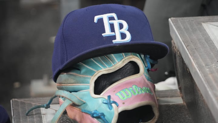 Sep 26, 2025; Toronto, Ontario, CAN; The hat and glove of Tampa Bay Rays third baseman Junior Caminero (13) in the dugout during the game against the Toronto Blue Jays at Rogers Centre. Sep 26, 2025; Toronto, Ontario, CAN; The hat and glove of Tampa Bay Rays third baseman Junior Caminero (13) in the dugout during the game against the Toronto Blue Jays at Rogers Centre.