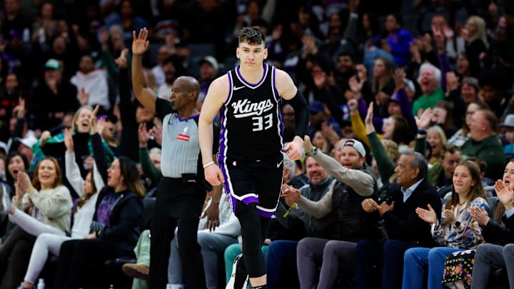 Mar 17, 2025; Sacramento, California, USA; Sacramento Kings forward Jake LaRavia (33) reacts after scoring a basket during the fourth quarter against the Memphis Grizzlies at Golden 1 Center. Mandatory Credit: Sergio Estrada-Imagn Images