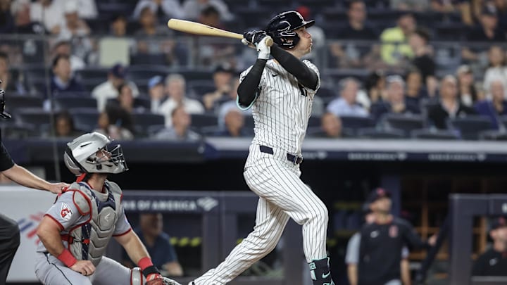 Jun 4, 2025; Bronx, New York, USA;  New York Yankees left fielder Cody Bellinger (35) hits a double in the ninth inning against the Cleveland Guardians at Yankee Stadium. Mandatory Credit: Wendell Cruz-Imagn Images