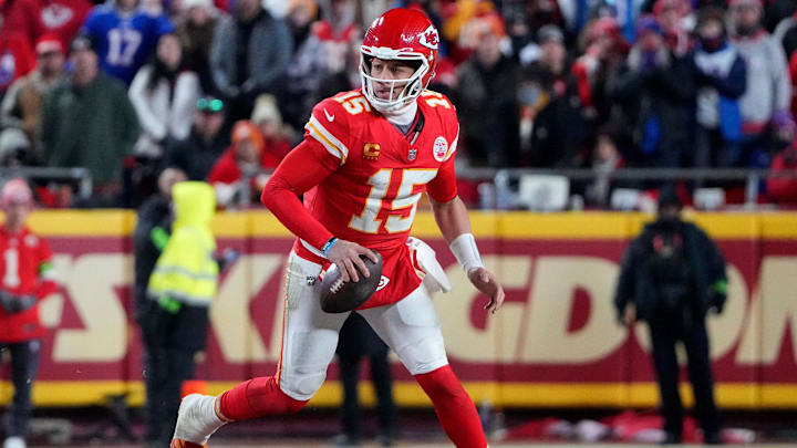 Jan 26, 2025; Kansas City, MO, USA; Kansas City Chiefs quarterback Patrick Mahomes (15) rushes the ball against the Buffalo Bills during the second half in the AFC Championship game at GEHA Field at Arrowhead Stadium. Mandatory Credit: Denny Medley-Imagn Images