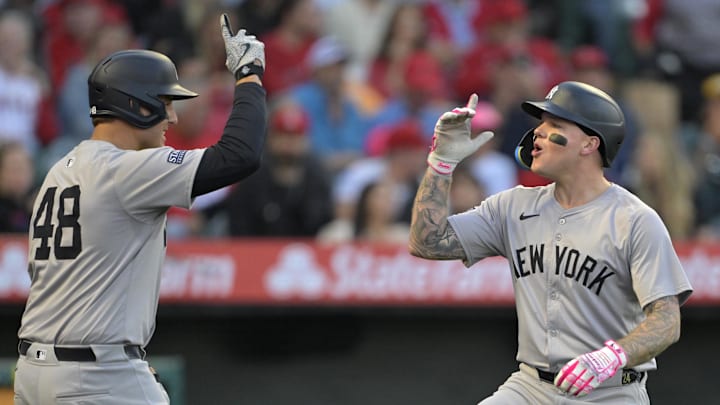 May 29, 2024; Anaheim, California, USA; New York Yankees left fielder Alex Verdugo (24) celebrates with first baseman Anthony Rizzo (48) after hitting a solo home run in the fourth inning against the Los Angeles Angels at Angel Stadium. Mandatory Credit: Jayne Kamin-Oncea-Imagn Images