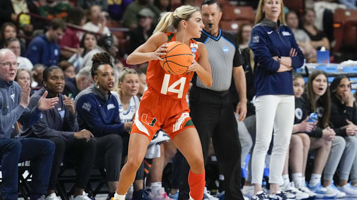 Miami Hurricanes guard Haley Cavinder (14) looks for an open teammate against the Villanova Wildcats during the NCAA Women s Tournament at Bon Secours Wellness Arena. Miami Hurricanes guard Haley Cavinder (14) looks for an open teammate against the Villanova Wildcats during the NCAA Women s Tournament at Bon Secours Wellness Arena.