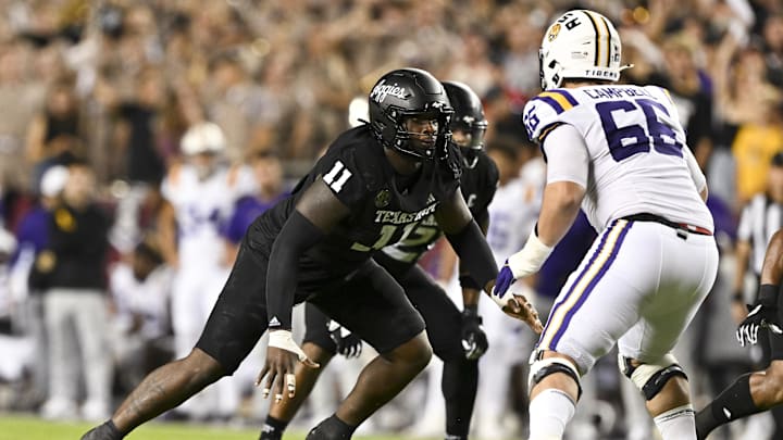 Oct 26, 2024; College Station, Texas, USA; Texas A&M Aggies defensive lineman Nic Scourton (11) defends in coverage against LSU Tigers offensive tackle Will Campbell (66) during the fourth quarter. The Aggies defeated the Tigers 38-23; at Kyle Field. Mandatory Credit: Maria Lysaker-Imagn Images.  