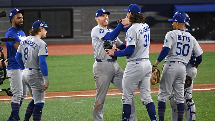 Oct 31, 2025; Toronto, Ontario, CAN; Los Angeles Dodgers first baseman Freddie Freeman (5) and pitcher Tyler Glasnow (31) celebrate after defeating the Toronto Blue Jays in game six of the 2025 MLB World Series at Rogers Centre. Mandatory Credit: Dan Hamilton-Imagn Images