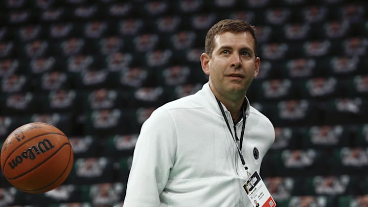 Feb 28, 2025; Boston, Massachusetts, USA; Boston Celtics president of basketball operations Brad Stevens throws a behind the back pass to one of his players before their game against the Cleveland Cavaliers at TD Garden. Mandatory Credit: Winslow Townson-Imagn Images