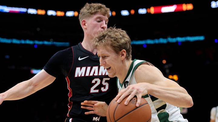 Mar 12, 2026; Miami, Florida, USA; Milwaukee Bucks guard AJ Green (20) drives to the basket against Miami Heat guard Kasparas Jakucionis (25) during the first quarter at Kaseya Center. Mandatory Credit: Sam Navarro-Imagn Images