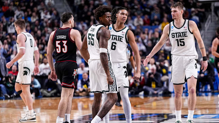 Michigan State forward Coen Carr (55) and forward Jordan Scott (6) celebrate a play against Louisville during the second half of NCAA Tournament Second Round at KeyBank Center in Buffalo on Saturday, March 21, 2026.