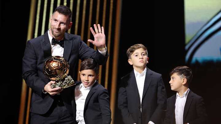 Lionel Messi and his three sons, Thiago, Ciro, and Mateo.