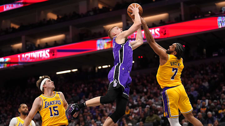 Dec 19, 2024; Sacramento, California, USA; Sacramento Kings guard Kevin Huerter (9) is fouled by Los Angeles Lakers guard Gabe Vincent (7) in the third quarter at the Golden 1 Center. Mandatory Credit: Cary Edmondson-Imagn Images Dec 19, 2024; Sacramento, California, USA; Sacramento Kings guard Kevin Huerter (9) is fouled by Los Angeles Lakers guard Gabe Vincent (7) in the third quarter at the Golden 1 Center. Mandatory Credit: Cary Edmondson-Imagn Images