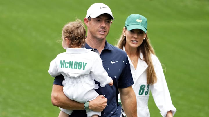 Apr 6, 2022: Rory McIlroy holds his daughter Poppy and walks with his wife Erica at The Masters golf tournament at Augusta National Golf Club.