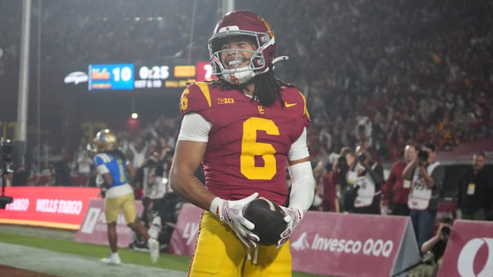 Nov 29, 2025; Los Angeles, California, USA; Southern California Trojans wide receiver Makai Lemon (6) celebrates after catching a 32-yard touchdown pass against the UCLA Bruins in the second half at United Airlines Field at Los Angeles Memorial Coliseum. Mandatory Credit: Kirby Lee-Imagn Images