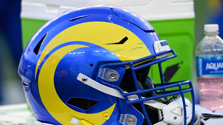 Nov 17, 2024; Foxborough, Massachusetts, USA; A Los Angeles Rams helmet sits on a cooler during the second half against the New England Patriots at Gillette Stadium. Mandatory Credit: Eric Canha-Imagn Images