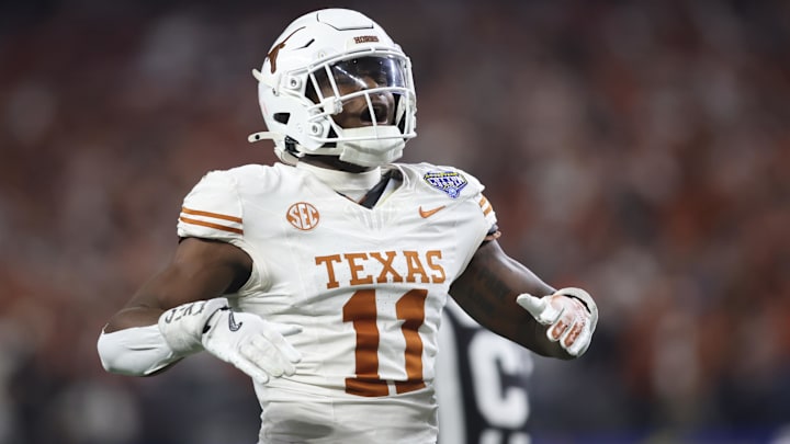 Jan 10, 2025; Arlington, Texas, USA; Texas Longhorns linebacker Colin Simmons (11) celebrates after a pass break up during the third quarter of the College Football Playoff semifinal against the Ohio State Buckeyes in the Cotton Bowl at AT&T Stadium. Mandatory Credit: Tim Heitman-Imagn Images Jan 10, 2025; Arlington, Texas, USA; Texas Longhorns linebacker Colin Simmons (11) celebrates after a pass break up during the third quarter of the College Football Playoff semifinal against the Ohio State Buckeyes in the Cotton Bowl at AT&T Stadium. Mandatory Credit: Tim Heitman-Imagn Images