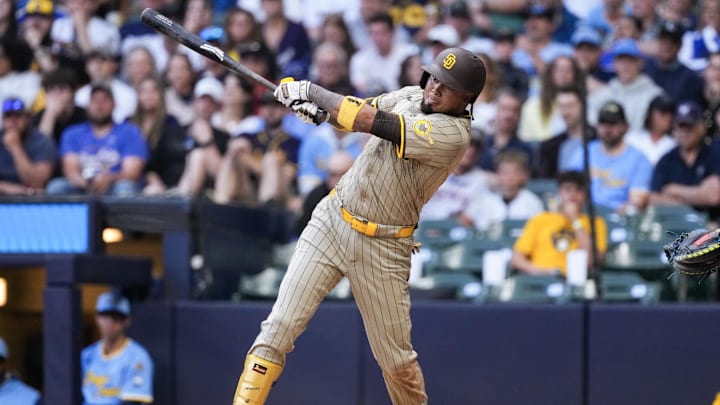 Jun 6, 2025; Milwaukee, Wisconsin, USA; San Diego Padres designated hitter Luis Arraez (4) hits an RBI single Jun 6, 2025; Milwaukee, Wisconsin, USA; San Diego Padres designated hitter Luis Arraez (4) hits an RBI single