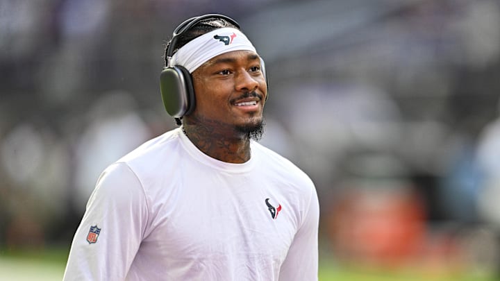 Sep 22, 2024; Minneapolis, Minnesota, USA; Houston Texans wide receiver Stefon Diggs (1) warms up before the game against the Minnesota Vikings at U.S. Bank Stadium.
