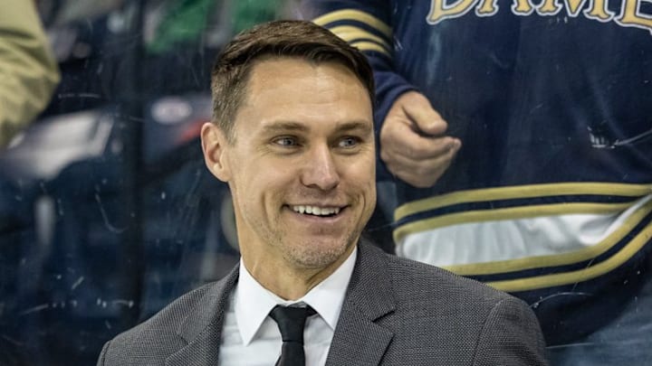 Brock Sheahan smiles after getting his first win as Notre Dame's head coach in men's hockey, 8-2 over visiting St. Lawrence on Oct. 16. 2025 Brock Sheahan smiles after getting his first win as Notre Dame's head coach in men's hockey, 8-2 over visiting St. Lawrence on Oct. 16. 2025
