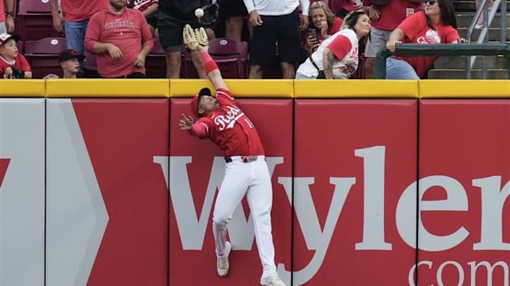 Cincinnati Reds outfielder Noelvi Marte jumps at the wall to rob a Pittsburgh Pirates home run in the ninth inning.