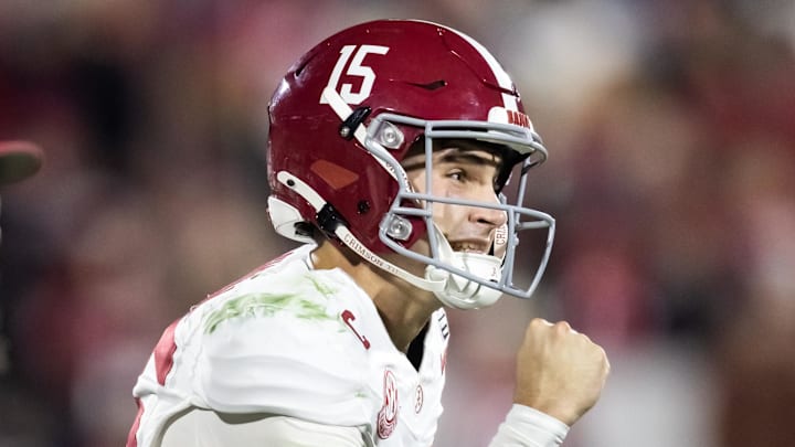 Dec 19, 2025; Norman, OK, USA; Alabama Crimson Tide quarterback Ty Simpson (15) celebrates against the Oklahoma Sooners during the CFP National Playoff First Round at Gaylord Family Oklahoma Memorial Stadium. Mandatory Credit: Mark J. Rebilas-Imagn Images