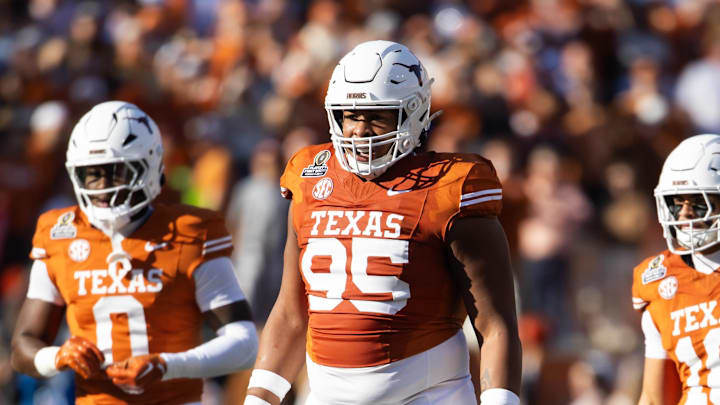 Dec 21, 2024; Austin, Texas, USA; Texas Longhorns defensive lineman Alfred Collins (95) against the Clemson Tigers during the CFP National playoff first round at Darrell K Royal-Texas Memorial Stadium. Mandatory Credit: Mark J. Rebilas-Imagn Images