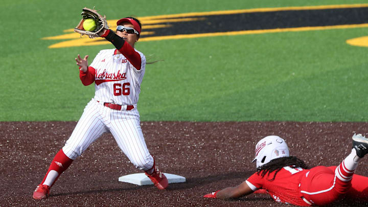 Indiana’s Brianna Copeland dives into second base as Nebraska’s Katelyn Caneda catches the ball during the 2024 Big Ten softball tournament.