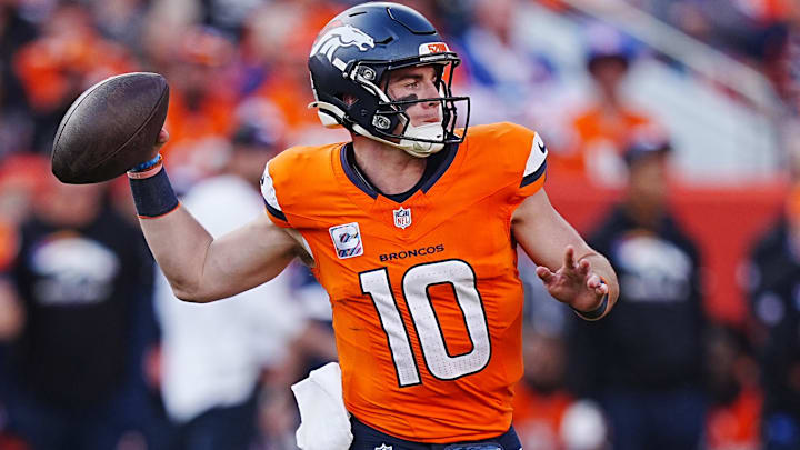 Oct 13, 2024; Denver, Colorado, USA; Denver Broncos quarterback Bo Nix (10) prepares to pass the ball in the second half against the Los Angeles Chargers at Empower Field at Mile High. 