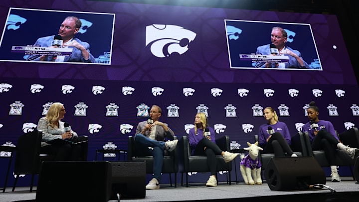 Kansas State head coach Jeff Mittie (left) speaks to media alongside players Taryn Sides, Nastja Claessens, and Izela Arenas during Big 12 Women's Basketball Media Day at T-Mobile Center. 