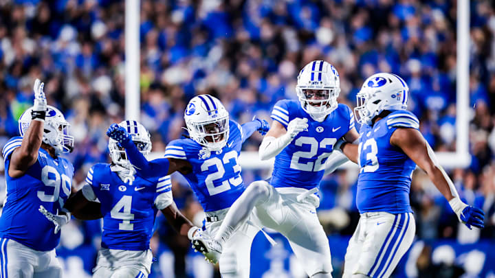 Tommy Prassas celebrates an interception with Jonathan Kabeya against Oklahoma State