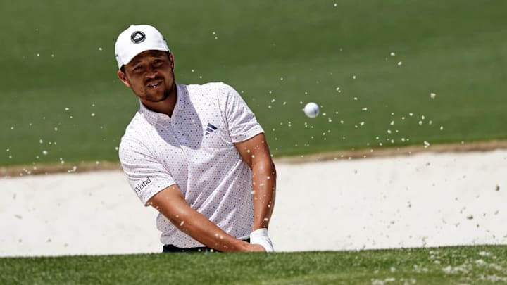 Apr 9, 2023; Augusta, Georgia, USA; Xander Schauffele plays a shot from a bunker on the second hole