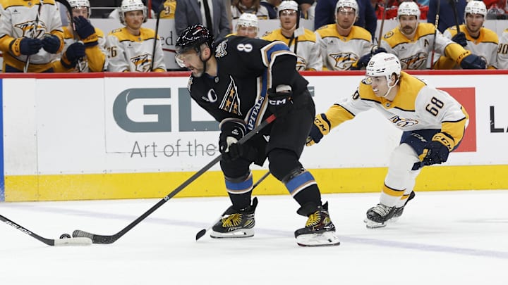 Nov 6, 2024; Washington, District of Columbia, USA; Washington Capitals left wing Alex Ovechkin (8) skates with the puck as Nashville Predators left wing Zachary L'Heureux (68) chases in the first period at Capital One Arena. Mandatory Credit: Geoff Burke-Imagn Images