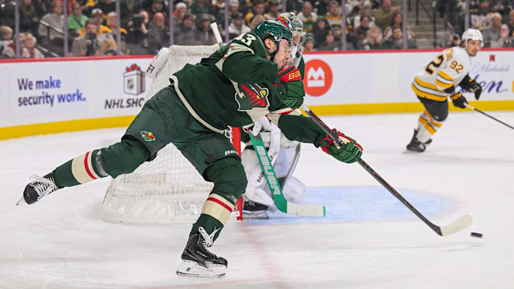 Dec 14, 2025; Saint Paul, Minnesota, USA;  Minnesota Wild defensemen Quinn Hughes (43) makes a pass against the Boston Bruins during the first period at Grand Casino Arena. Mandatory Credit: Nick Wosika-Imagn Images

