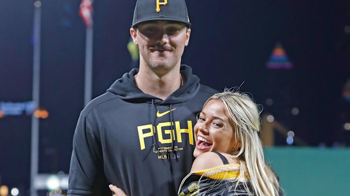 Pittsburgh Pirates starting pitcher Paul Skenes (30) poses with his girlfriend Louisiana State University gymnast Livvy Dunne (right) after Skenes made his major league debut against the Chicago Cubs.