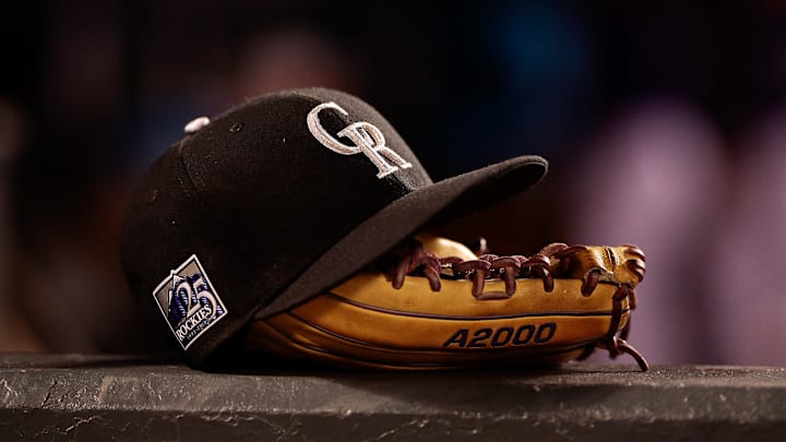 May 10, 2018; Denver, CO, USA; A detail view of a Colorado Rockies players hat and glove in the fifth inning against the Milwaukee Brewers at Coors Field. 