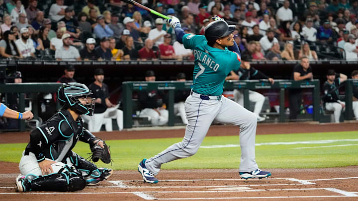 Seattle Mariners second baseman Jorge Polanco hits a single during a game against the Arizona Diamondbacks on June 11 at Chase Field.
