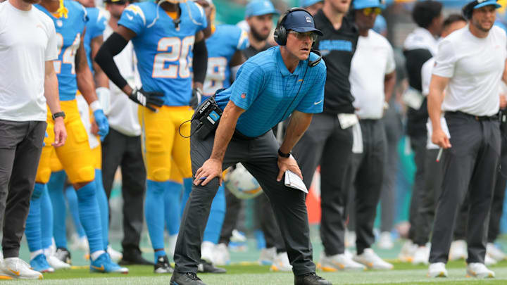 Oct 12, 2025; Miami Gardens, Florida, USA; Los Angeles Chargers head coach Jim Harbaugh watches from the sideline against the Miami Dolphins during the first quarter at Hard Rock Stadium. Mandatory Credit: Sam Navarro-Imagn Images Oct 12, 2025; Miami Gardens, Florida, USA; Los Angeles Chargers head coach Jim Harbaugh watches from the sideline against the Miami Dolphins during the first quarter at Hard Rock Stadium. Mandatory Credit: Sam Navarro-Imagn Images
