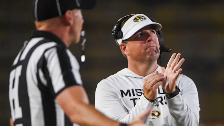 Aug 28, 2025; Columbia, MO, USA; Missouri Tiger head coach Eli Drinkwitz calls a timeout in the middle of their matchup against the Central Arkansas Bears in Faurot Field at Memorial Stadium. 