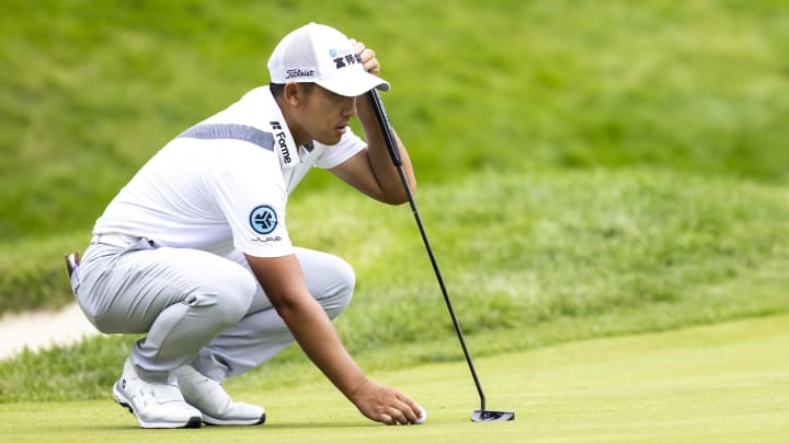 Jul 7, 2024; Silvis, Illinois, USA; C.T. Pan lines up a putt on the 18th green during the final round of the John Deere Classic golf tournament. Mandatory Credit: Joseph Cress-USA TODAY Sports