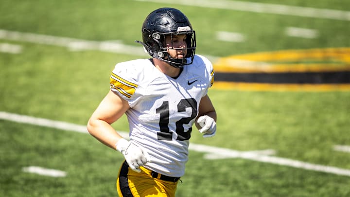 Apr 26, 2025; Iowa City, IA, USA; Iowa linebacker Jaxon Rexroth (12) runs to the sideline during a spring NCAA football open practice at Kinnick Stadium. Mandatory Credit: Joseph Cress/For the Register