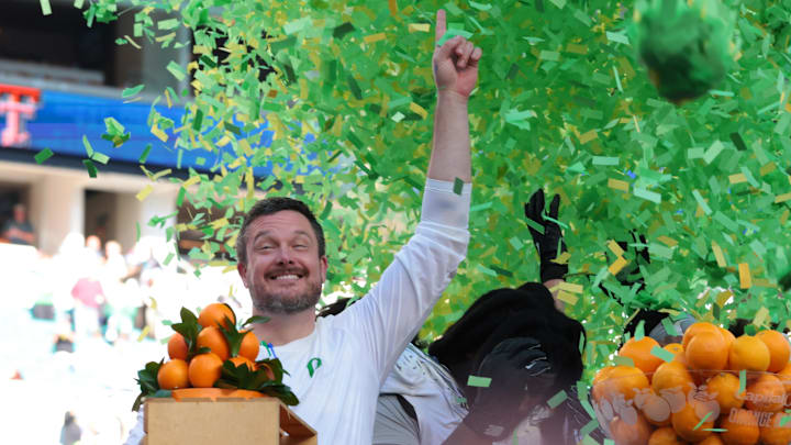 Jan 1, 2026; Miami Gardens, FL, USA; Oregon Ducks head coach Dan Lanning and players on the podium to receive the champions trophy following the 2025 Orange Bowl and quarterfinal game of the College Football Playoff against the Texas Tech Red Raiders at Hard Rock Stadium. Mandatory Credit: Sam Navarro-Imagn Images