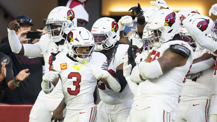 Dec 15, 2024; Glendale, Arizona, USA; Arizona Cardinals safety Budda Baker (3) celebrates a turnover with teammates against the New England Patriots at State Farm Stadium. Mandatory Credit: Mark J. Rebilas-Imagn Images